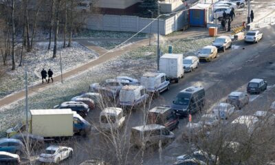Officers at the scene where two police officers and another person were killed. Pic: Reuters/Ramil Sitdikov