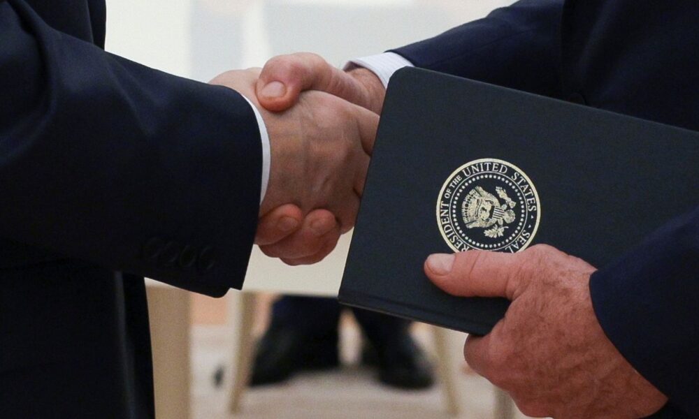 Vladimir Putin and Steve Witkoff shaking hands in August. AP file pic