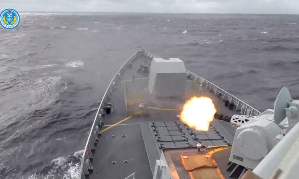 A ship fires a weapon during drills east of Taiwan, in this screenshot from a video released by the Eastern Theatre Command