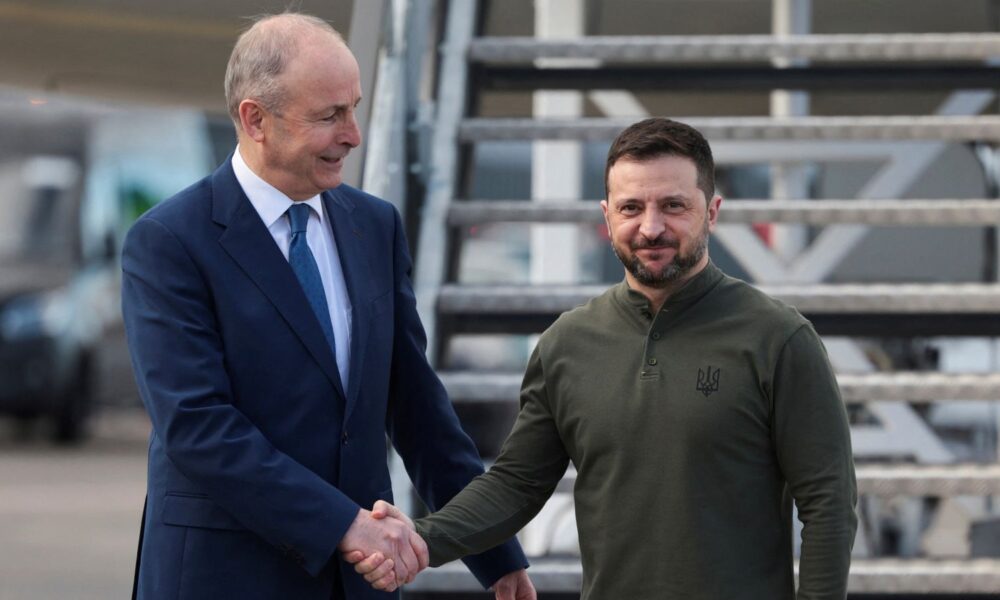 Micheal Martin greets Volodymyr Zelenskyy as he briefly stops in Ireland on way to the US in February. Pic: Reuters