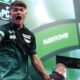 Charlie Manby celebrates defeating Cameron Menzies on day five of the Paddy Power World Darts Championship at the Alexandra Palace, London.