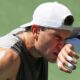 Jack Draper wipes sweat from his face between serves against Federico Agustin Gomez at the US Open