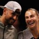Aryna Sabalenka and Nick Kyrgios laugh ahead of their Battle of the Sexes tennis match in Dubai, United Arab Emirates, Sunday Dec. 28, 2025. (Amr Alfiky/Pool Photo via AP)