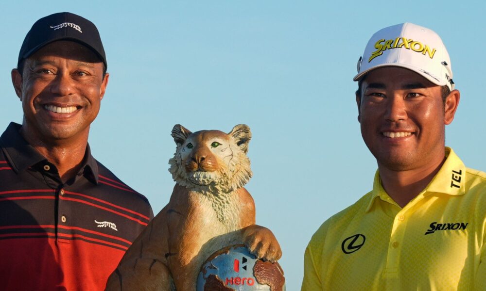 Hideki Matsuyama, of Japan, right, poses for a photo with golf legend Tiger Woods after winning the Hero World Challenge