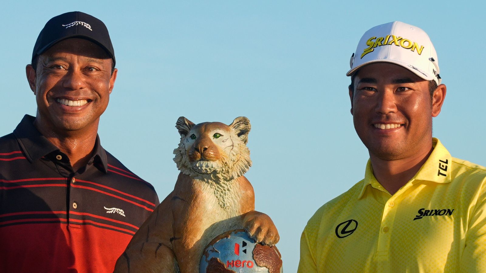 Hideki Matsuyama, of Japan, right, poses for a photo with golf legend Tiger Woods after winning the Hero World Challenge
