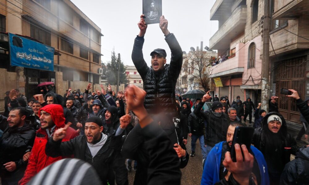 Mourners gather at Syria's Homs mosque for victims of deadly bombing