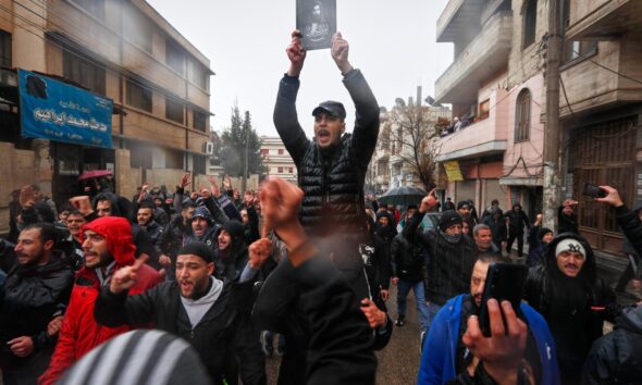 Mourners gather at Syria's Homs mosque for victims of deadly bombing