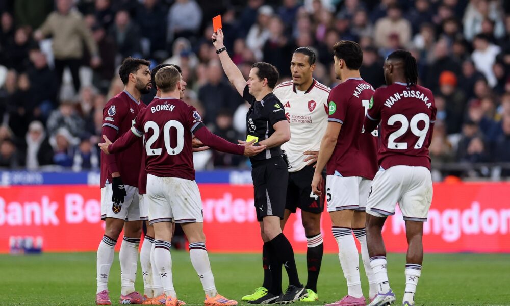 Darren England shows a second yellow and subsequent red card to Lucas Paqueta of West Ham