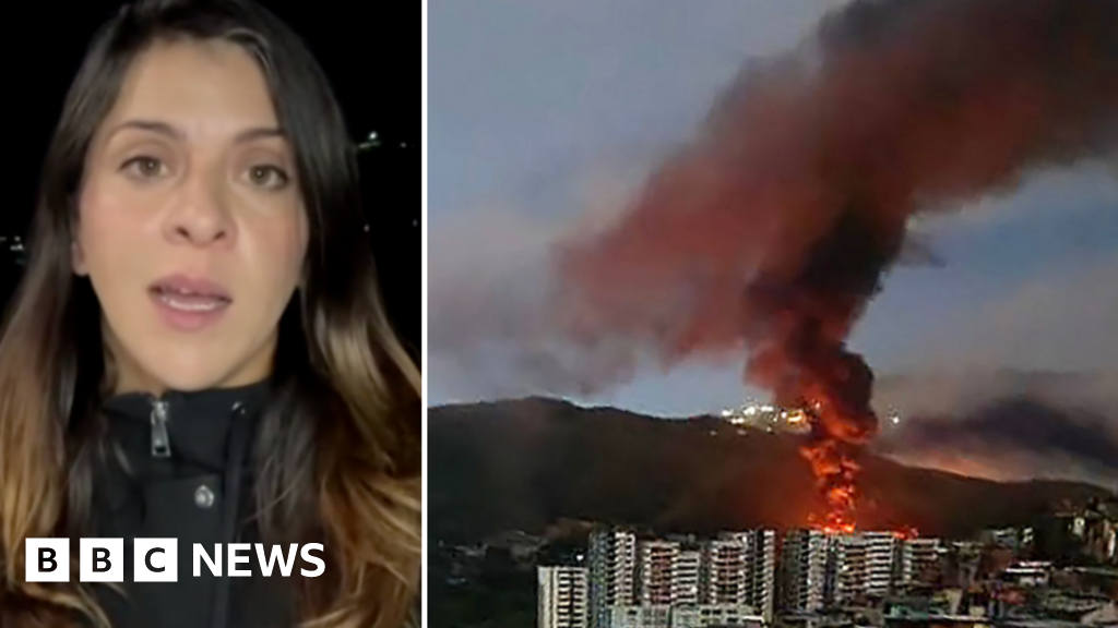 Reporter in Caracas describes hearing loud bangs and planes