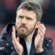 Michael Carrick applauds fans during his team in charge of Middlesbrough