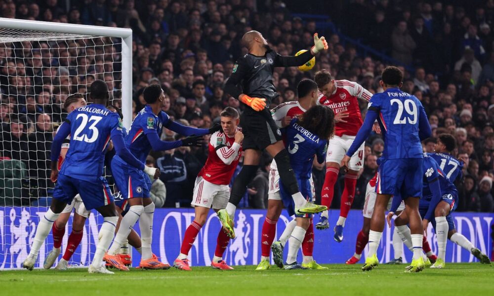 Ben White heads the ball