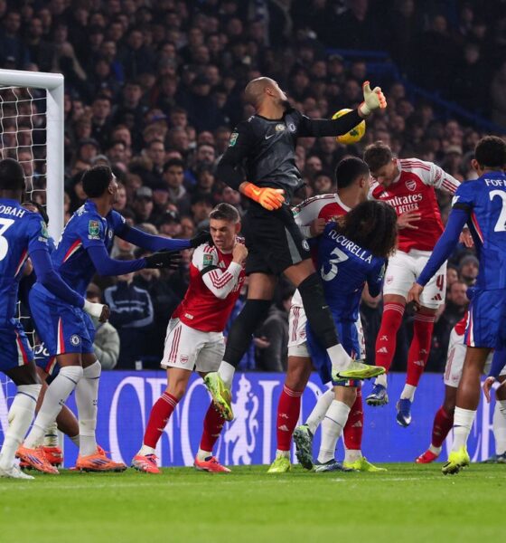 Ben White heads the ball