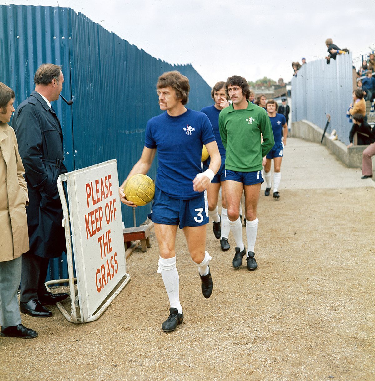 Eddie McCreadie leading the Chelsea side out while Stamford Bridge was being developed in the 1970s