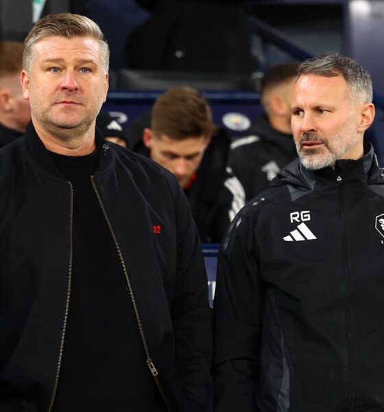 Salford City manager Karl Robinson (L) looks on next to assistant manager Ryan Giggs during the Emirates FA Cup Third Round match between Manchester City and Salford City at Etihad Stadium on January 11, 2025 in Manchester, England