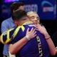 BLACKPOOL, ENGLAND - JULY 27: Luke Littler of England embraces Faith Millar after victory in the Final match between James Wade of England and Luke Littler of England on day nine of the 2025 Betfred World Matchplay at Winter Gardens on July 27, 2025 in Blackpool, England. (Photo by Lewis Storey/Getty Images)