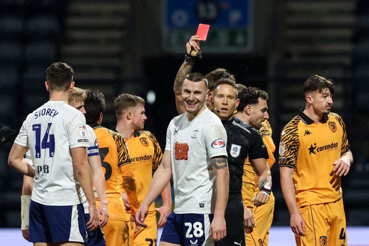 Referee Stephen Martin shows Preston North End's Milutin Osmajic a straight red