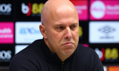 Arne Slot in front of a TV camera.