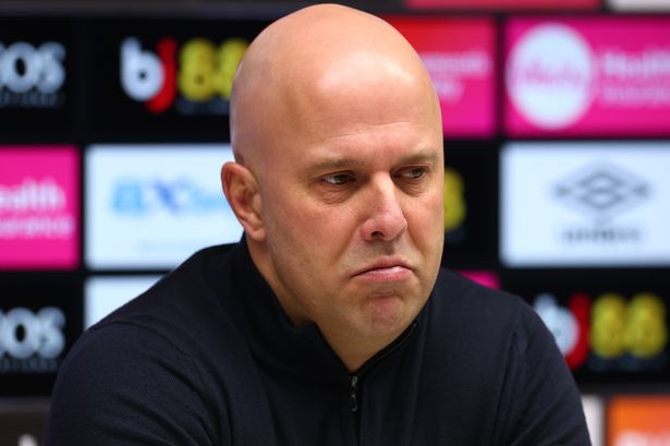 Arne Slot in front of a TV camera.