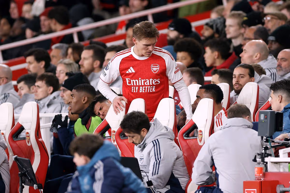 LONDON, ENGLAND - JANUARY 25: Martin Odegaard of Arsenal takes a seat in the dugout after being substituted off during the Premier League match between Arsenal and Manchester United at Emirates Stadium on January 25, 2026 in London, England. (Photo by Alex Pantling/Getty Images)