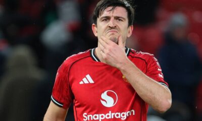 Harry Maguire holds his chin with his left hand