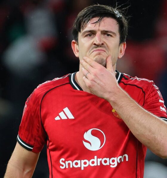Harry Maguire holds his chin with his left hand