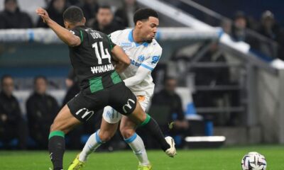 Matthieu Udol challenges Ethan Nwaneri.