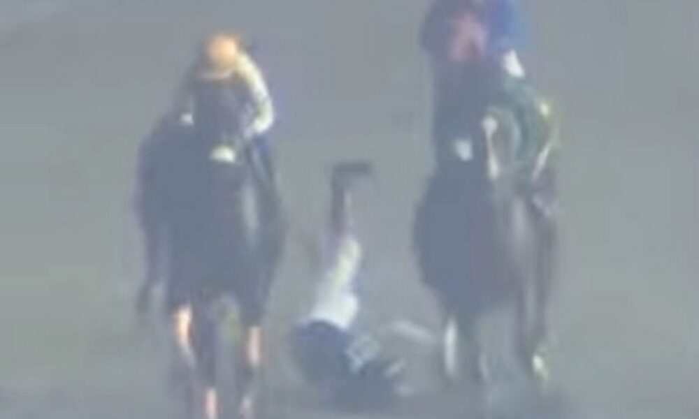 Elvin Abrea is thrown to the ground during the race