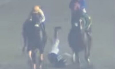 Elvin Abrea is thrown to the ground during the race