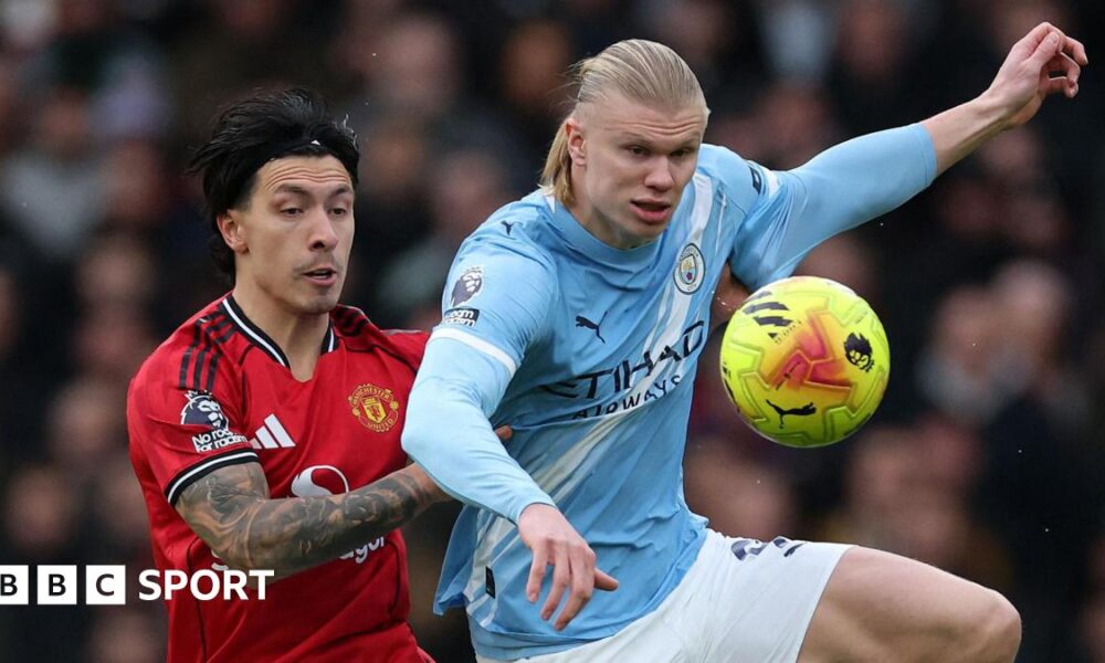 Lisandro Martinez and Erling Haaland fight for possession in the Manchester derby