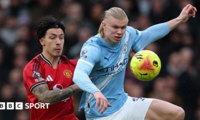 Lisandro Martinez and Erling Haaland fight for possession in the Manchester derby