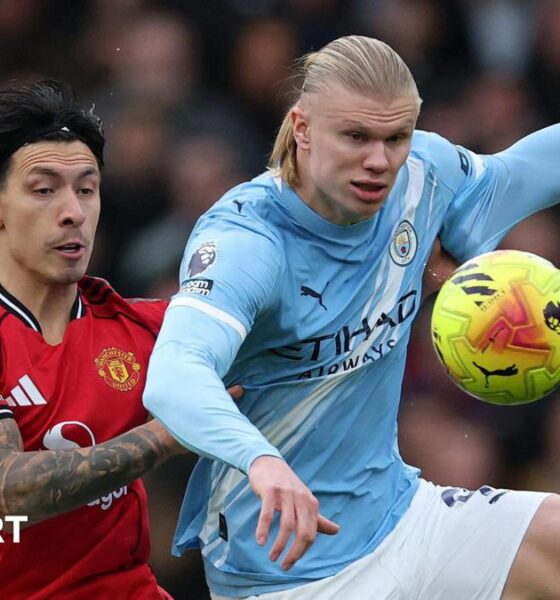 Lisandro Martinez and Erling Haaland fight for possession in the Manchester derby