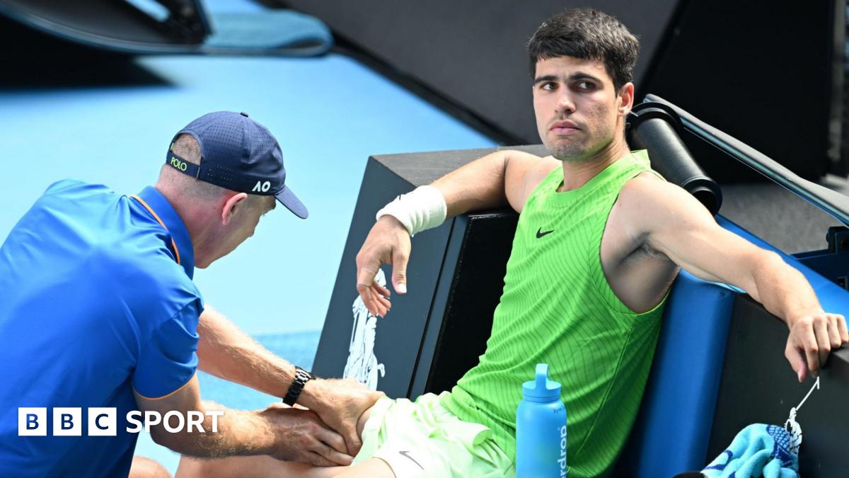 Carlos Alcaraz receives treatment during his Australian Open semi-final