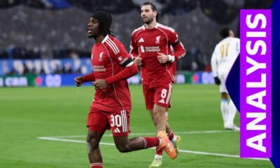 Dominik Szoboszlai and Jeremie Frimpong run on the pitch in red Liverpool kit