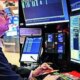 Wall Street ends higher; banks gain following results, chips rally with TSMC