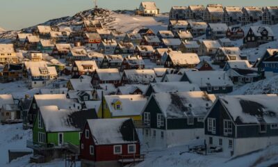 Houses line a hillside in Nuuk, Greenland.
