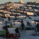 Houses line a hillside in Nuuk, Greenland.