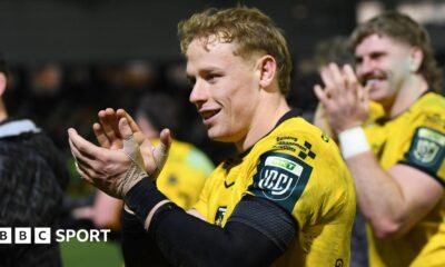 David Richards applauds the Dragons supporters after victory against Scarlets