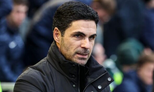 Mikel Arteta sitting in the dugout.