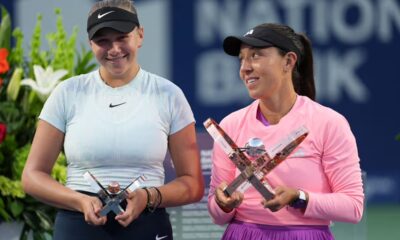 Jessica Pegula of the United States (R) and second place winner Amanda Anisimova of the United States (L) pose with the trophies after the final match of WTA 1000 National Bank Open
