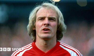 Terry Yorath wearing a red Wales matchday shirt