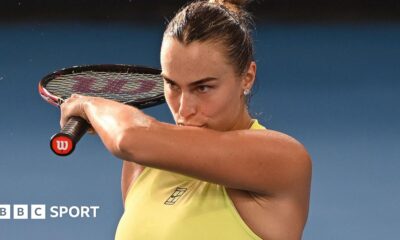 Jannik Sinner and Carlos Alcaraz laugh during the Australian Open's One Point Slam event