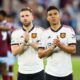 LONDON, ENGLAND - MAY 7: Casemiro and Luke Shaw of Manchester United applaud the fans after the Premier League match between West Ham United and Manchester United at London Stadium on May 7, 2023 in London, United Kingdom. (Photo by Craig Mercer/MB Media/Getty Images)