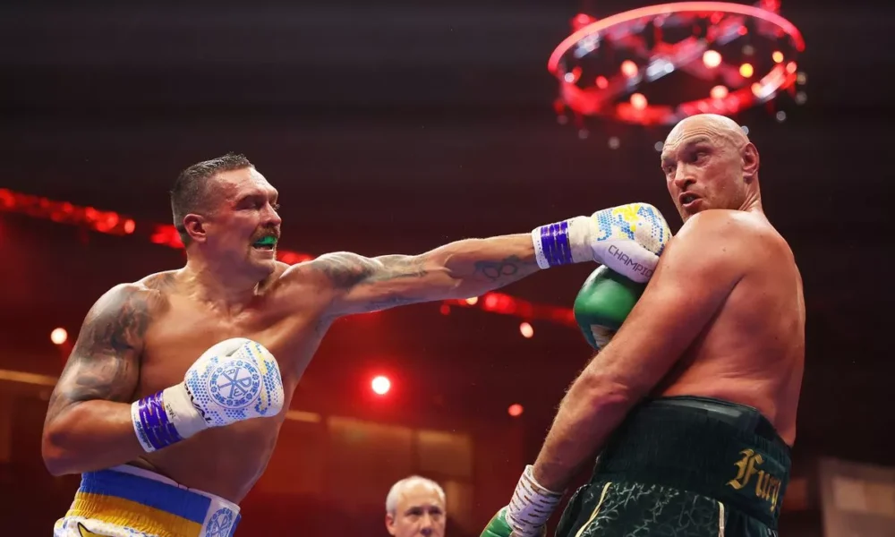Oleksandr Usyk punches Tyson Fury