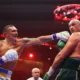 Oleksandr Usyk punches Tyson Fury