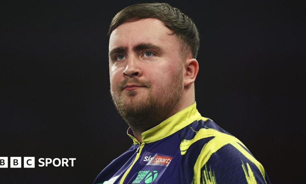 Luke Littler looks pensive during his Bahrain Masters defeat by Gerwyn Price