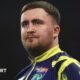 Luke Littler looks pensive during his Bahrain Masters defeat by Gerwyn Price