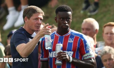 Marc Guehi and Oliver Glasner manager sat side by side during a media conference ahead of the Conference League match between Dynamo Kyiv and Crystal Palace in October.