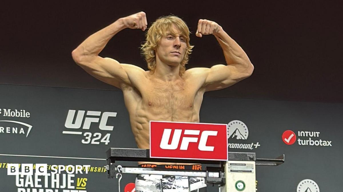 Paddy Pimblett flexes his muscles as he weighs in