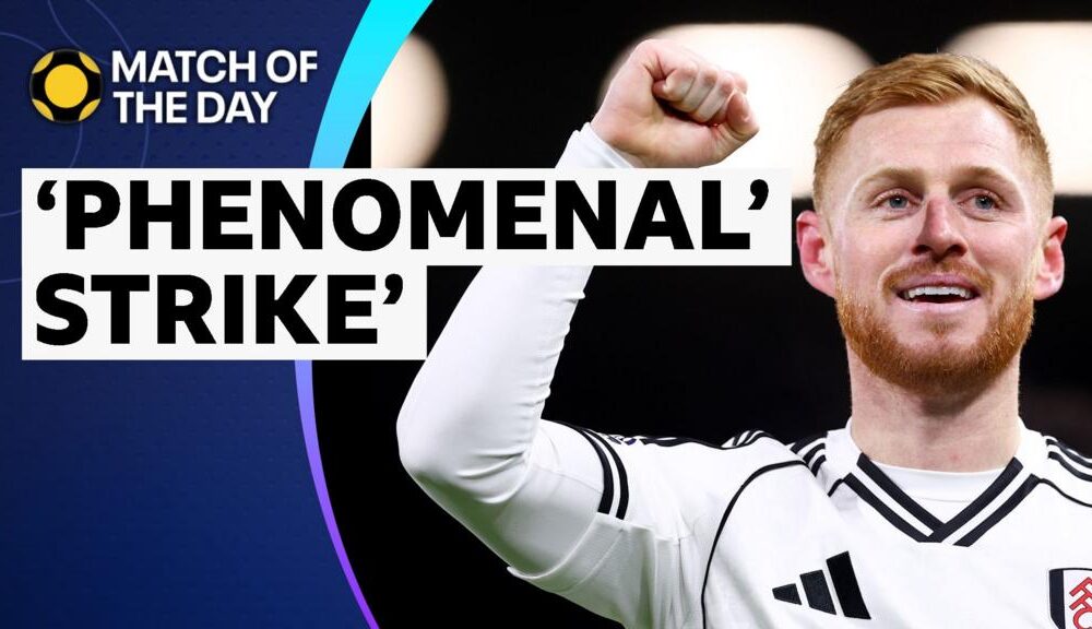 Harrison Reed celebrates with fist in the air in Fulham kit