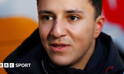 Close-up of Isack Hadjar's face and dark collar